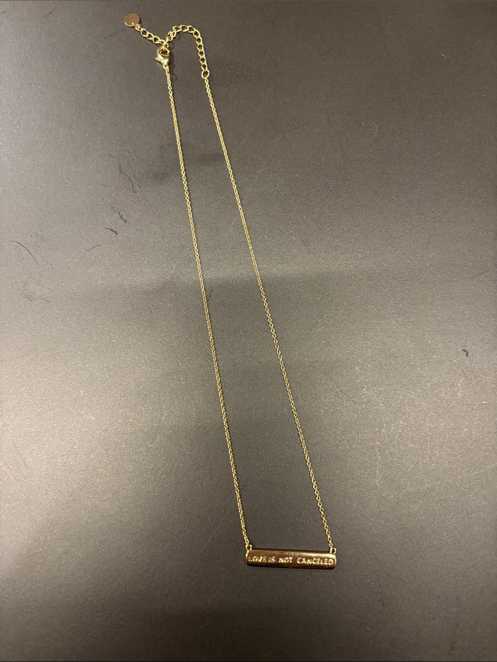 Altar’d state Gold Bar Pendant Necklace - "Love Is Not Canceled". 12” adjustable